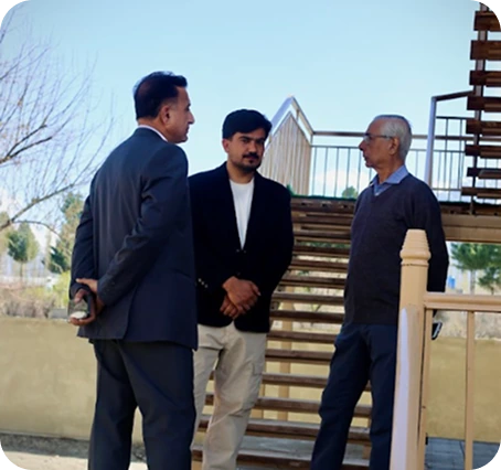Visitors walking through the campus courtyard